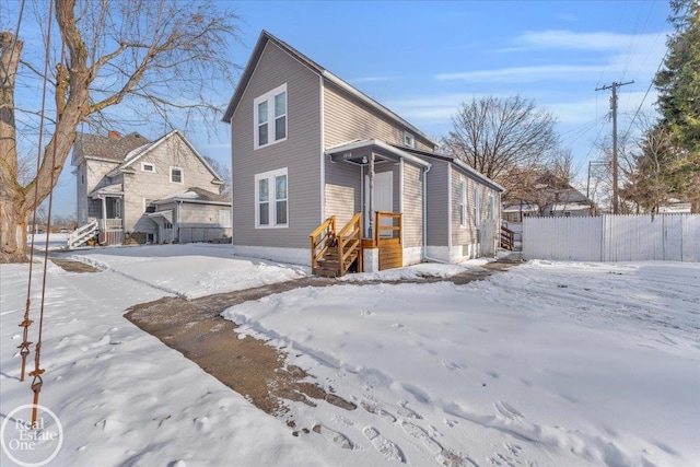 view of snow covered house