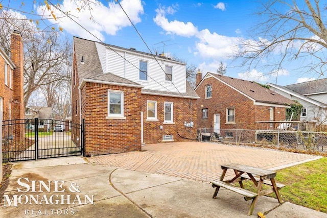 rear view of property with a patio area