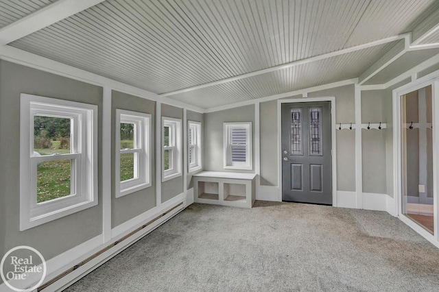 unfurnished sunroom with lofted ceiling, a baseboard heating unit, and a healthy amount of sunlight