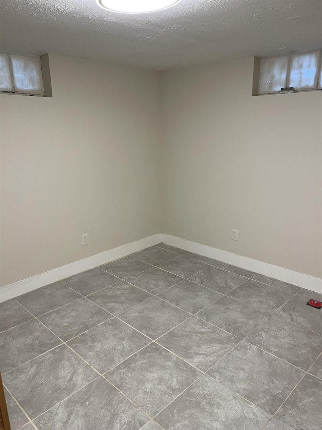 basement with a textured ceiling