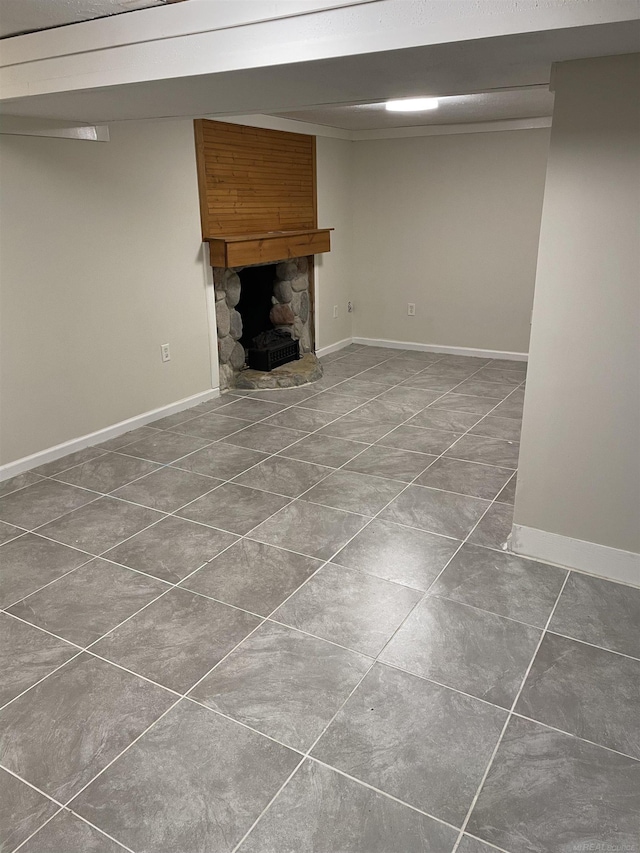 unfurnished living room featuring a stone fireplace