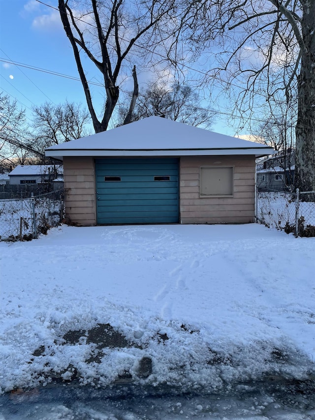 view of snow covered garage