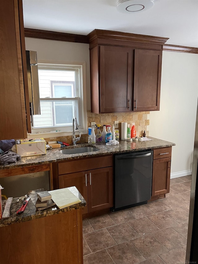 kitchen featuring dark stone countertops, dishwashing machine, ornamental molding, sink, and backsplash