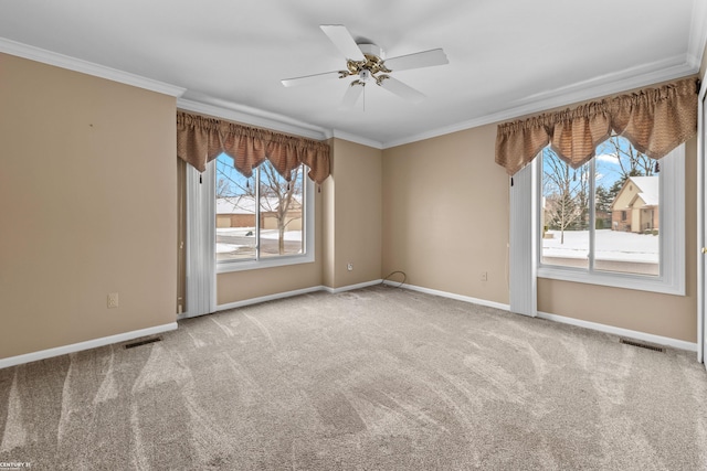 unfurnished room with carpet flooring, ceiling fan, and crown molding