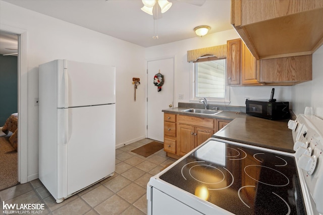 kitchen with sink, white appliances, and ceiling fan