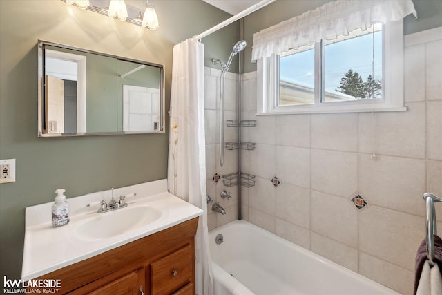 bathroom featuring shower / bath combo and vanity