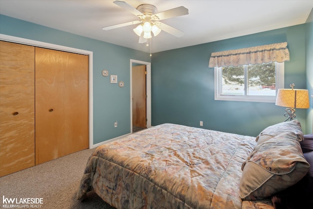 bedroom with ceiling fan, a closet, and carpet flooring