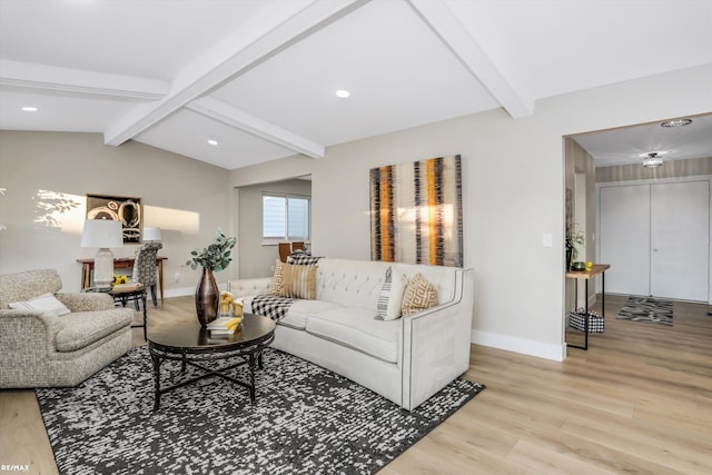 living room with light wood-type flooring and beamed ceiling