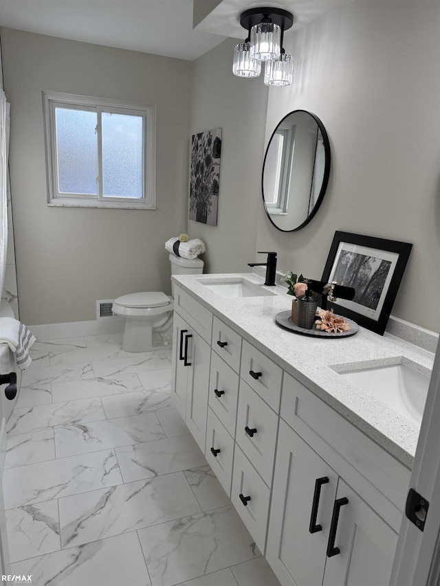 bathroom with vanity and toilet