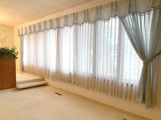 interior space featuring a textured ceiling