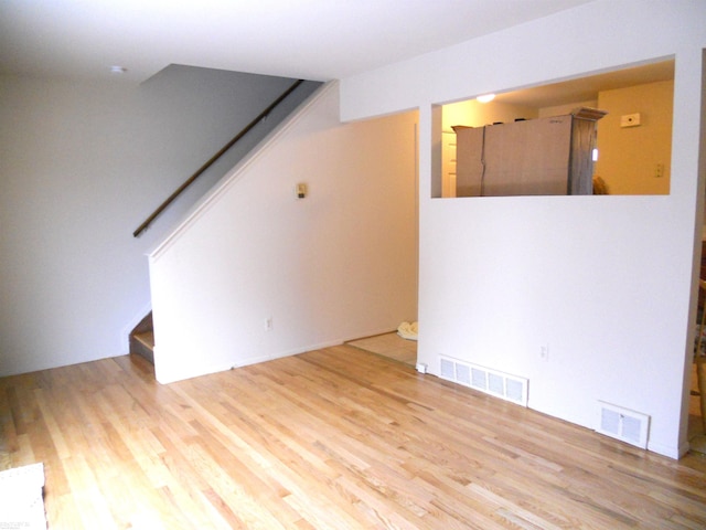 spare room with light hardwood / wood-style floors