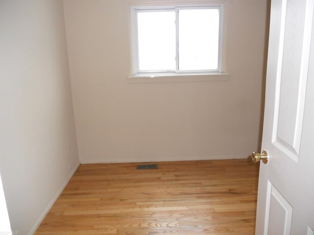 spare room with light hardwood / wood-style floors