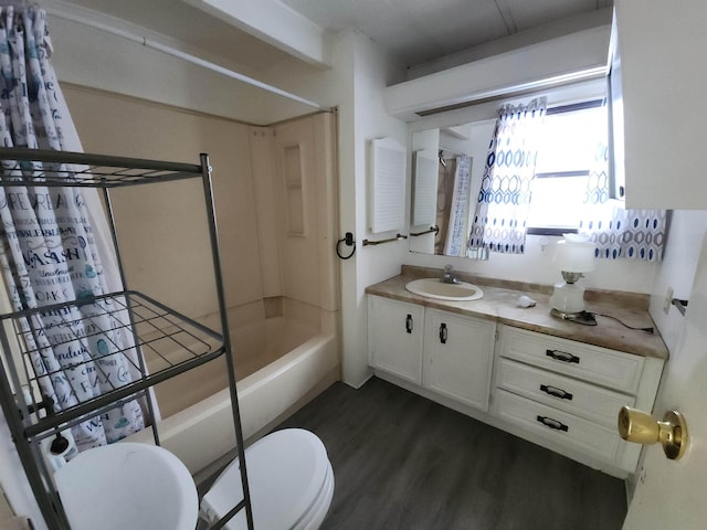 full bathroom featuring toilet, vanity, wood-type flooring, and shower / bathtub combination with curtain