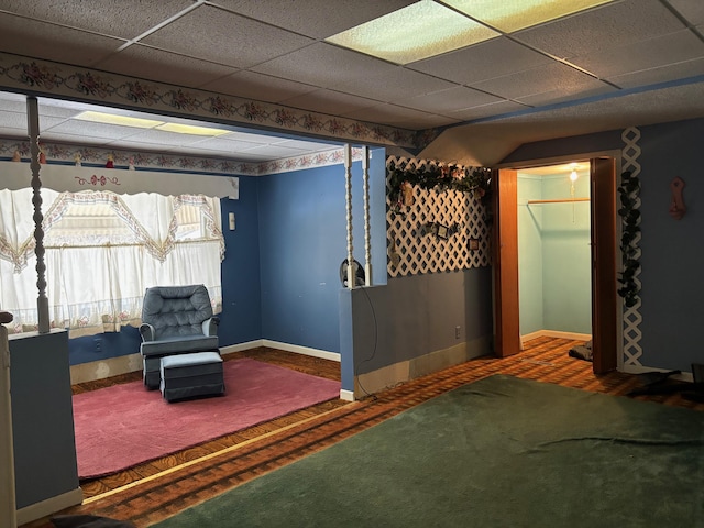 unfurnished room featuring a drop ceiling