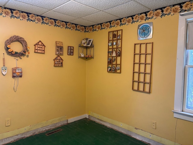 empty room featuring a paneled ceiling