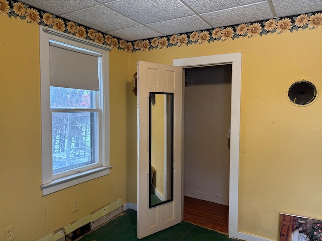 interior space featuring a paneled ceiling