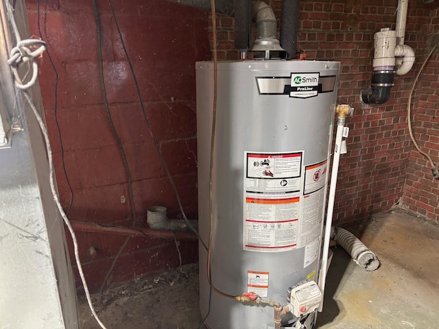 utility room with gas water heater