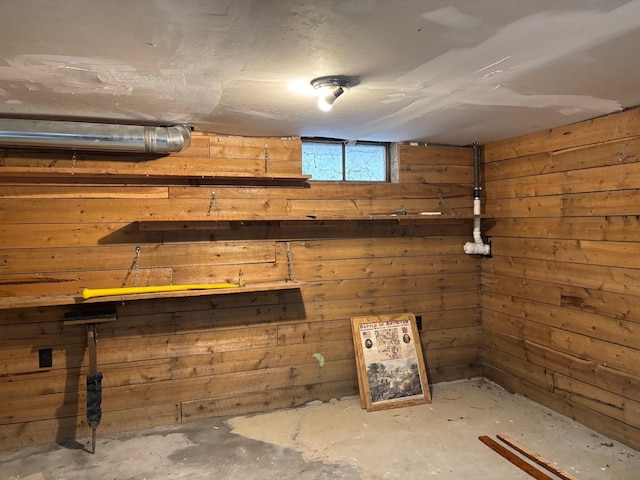 basement with wooden walls