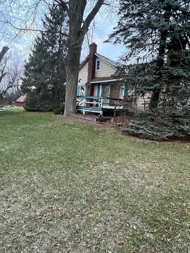 view of yard featuring a wooden deck