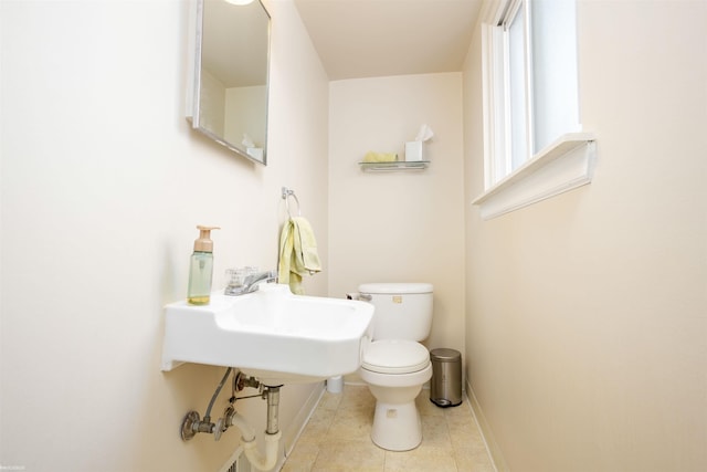 bathroom with toilet and sink