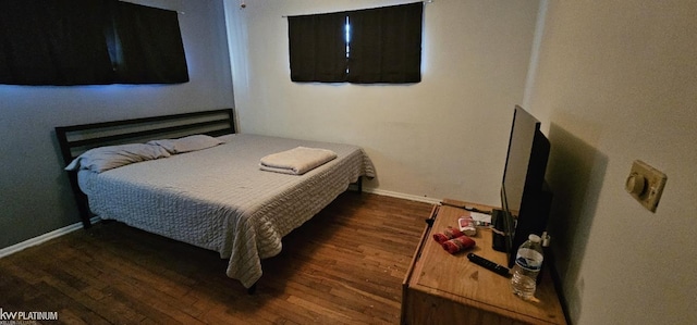 bedroom featuring dark wood-type flooring