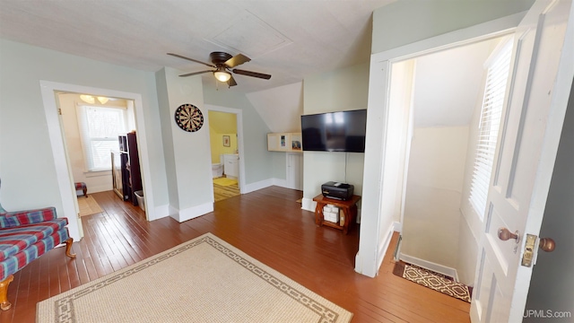 living room with hardwood / wood-style flooring and ceiling fan