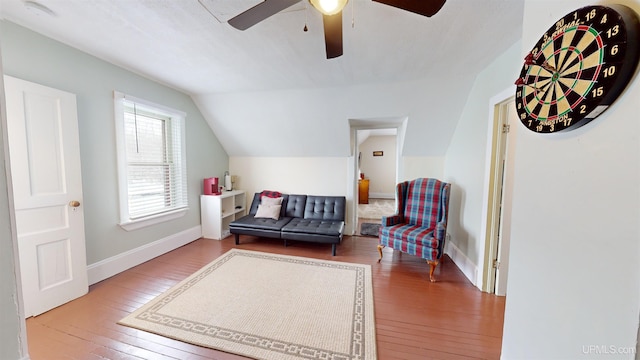 sitting room featuring ceiling fan, hardwood / wood-style floors, and lofted ceiling