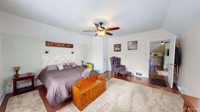 bedroom with vaulted ceiling, light wood-type flooring, and ceiling fan