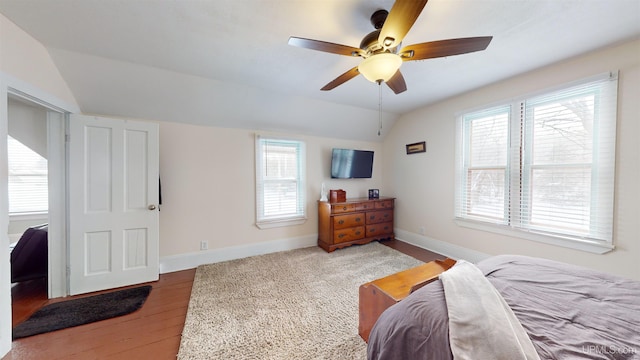 bedroom featuring lofted ceiling, wood-type flooring, and ceiling fan