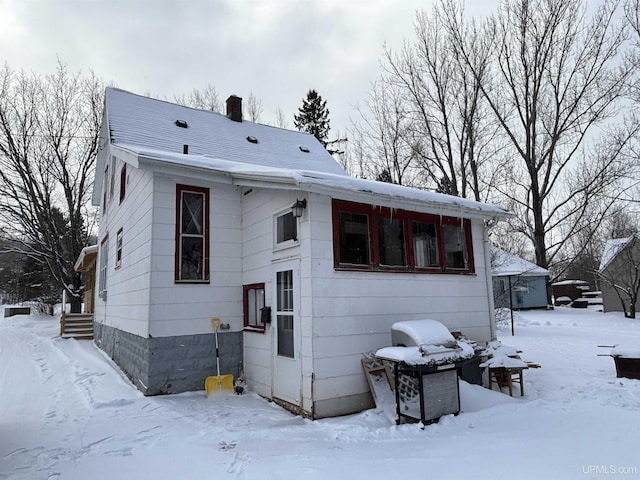 view of snow covered house