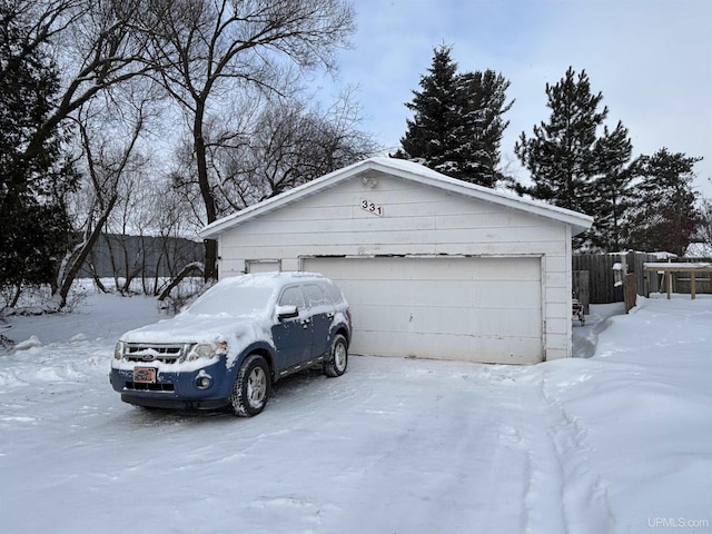 view of snow covered garage