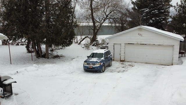 view of snow covered garage