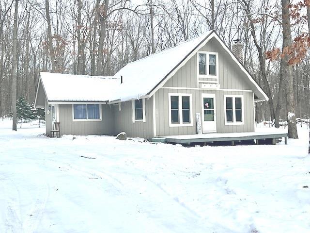 view of snow covered house