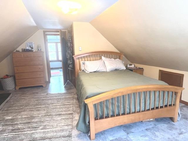 bedroom featuring vaulted ceiling