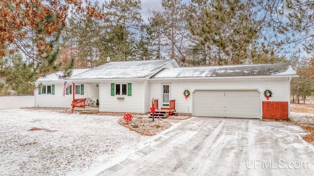 single story home featuring a garage