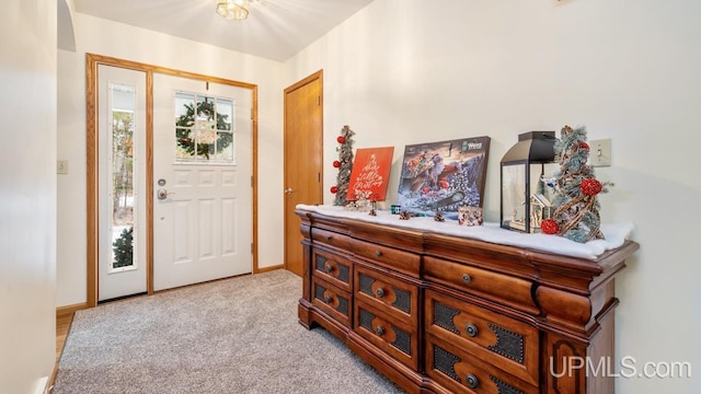 view of carpeted foyer