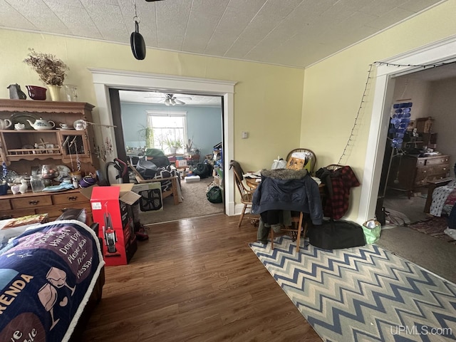 dining area with ceiling fan and dark hardwood / wood-style flooring