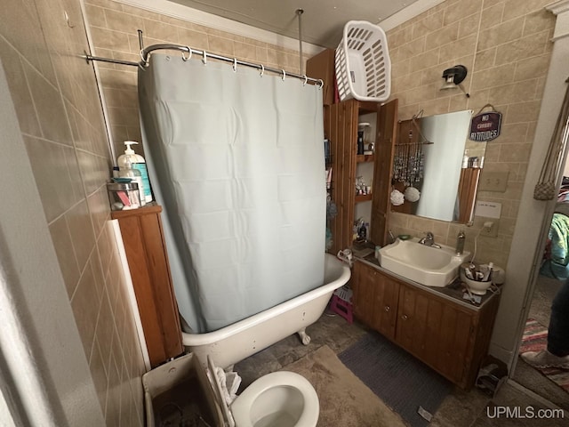 full bathroom featuring toilet, vanity, shower / bath combo with shower curtain, tile walls, and decorative backsplash