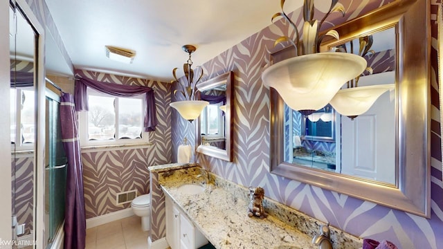 bathroom with sink, tile patterned flooring, and toilet