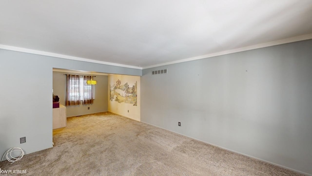 carpeted empty room with ornamental molding