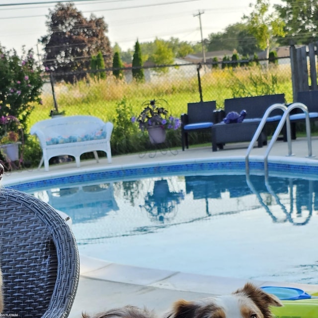 view of swimming pool featuring an outdoor hangout area