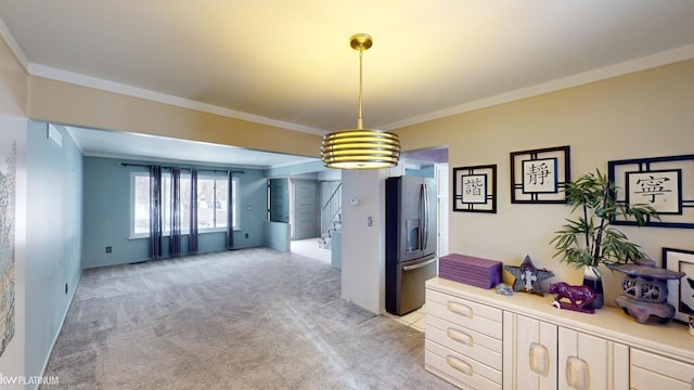 unfurnished dining area with crown molding and light carpet