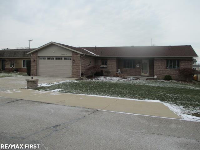 single story home featuring a garage