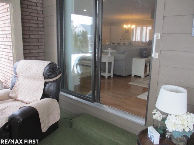 interior space featuring a chandelier and wood-type flooring