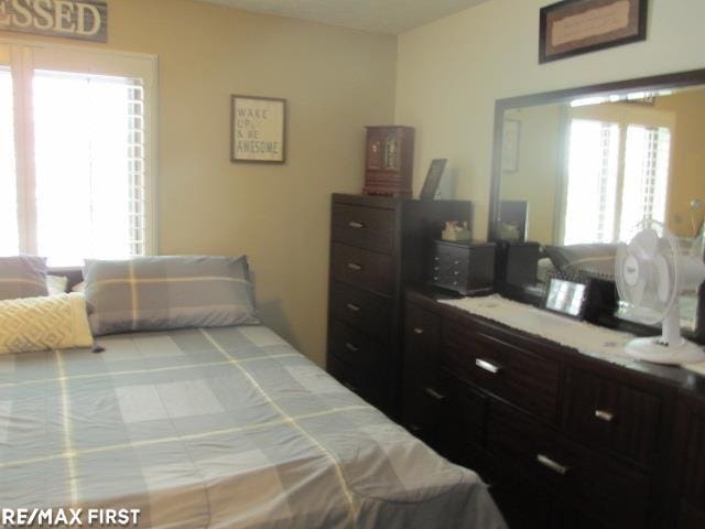 bedroom featuring multiple windows