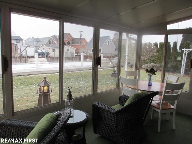 sunroom / solarium with lofted ceiling