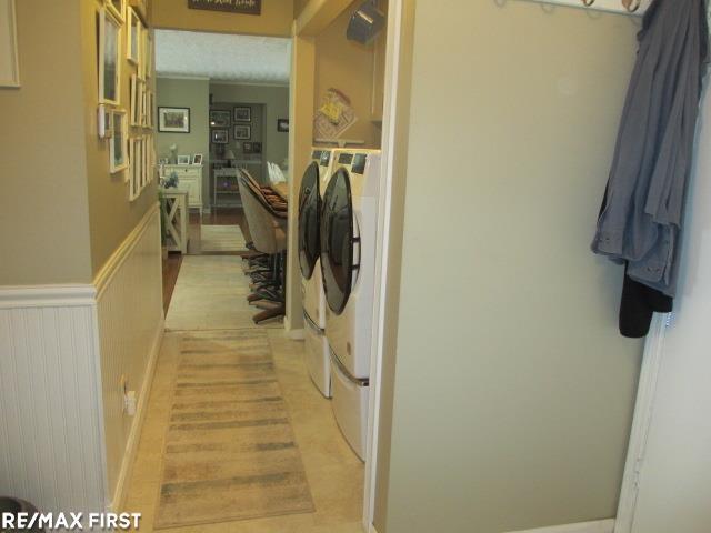 washroom with washing machine and clothes dryer