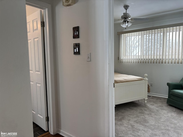 carpeted bedroom with ceiling fan