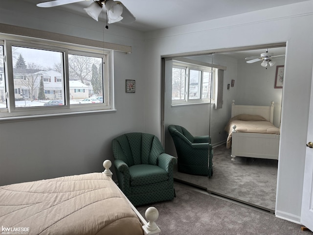 bedroom featuring carpet floors, ceiling fan, and a closet