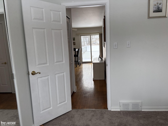 hallway featuring carpet